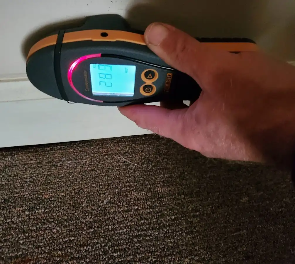 Moisture detection at baseboard during Storm Damage Restoration in Senatobia